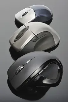 Black Background Studio Shot Prints: Modern wireless computer mouses on black background