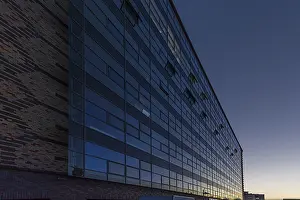 Glass Facade Exterior View Prints: Modernized facade of the former egg cold store at dusk