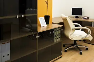 Deserted Office Space Prints: The monitor on a table at modern office