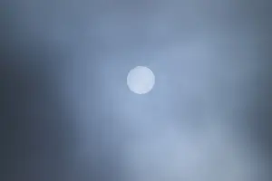 Southern Germany Atmosphere Prints: Moon shining through clouds at evening
