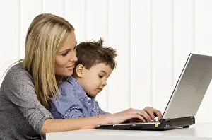 Mother Working From Home Prints: Mother and son at the computer