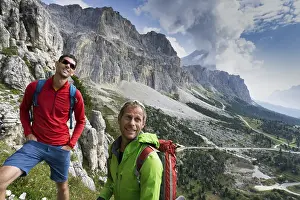 UNESCO Site Prints: A mountain guide and client looking up and checking out the climbing route before them