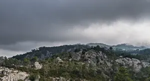 Uninhabited Mountainous Region Prints: Mountain landscape with dramatic clouds