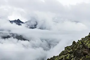 Austria Mountain Peaks Prints: Mountain peak rises from clouds