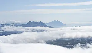 Cloudy Sky Mountain Range Prints: Mountain peaks above the clouds