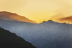 Orange Colored Sky At Sunset Prints: Mountain sunset and colored sky with clouds