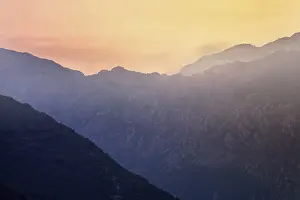 Atmospheric Light Of The Setting Sun Prints: Mountain sunset and colored sky with clouds