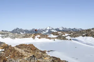 Mountaineer in rocky high mountain landscape