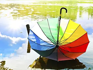 Prints of Multicolored Umbrella at the Water Riga, Latvia Latvia Prints: Multicolored Umbrella Print at Riga, Latvia Waterfront