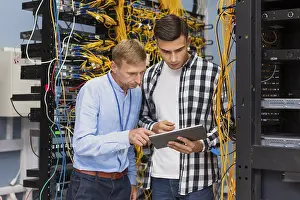 Medical Diagnosis Prints: Network engineers with tablet medium shot