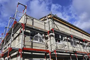 Residential Construction Site Prints: New building with completed basic rendering of the exterior facade New building with completed basic rendering of