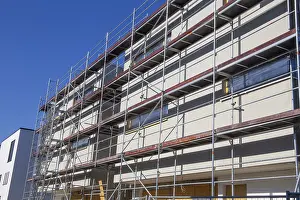 Residential Construction Site Prints: New building with completed basic rendering of the exterior facade New building with completed basic rendering of
