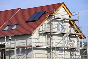 House Building Process Prints: New building with completed basic rendering of the exterior facade New building with completed basic rendering of