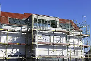 House Building Process Prints: New building with completed basic rendering of the exterior facade New building with completed basic rendering of