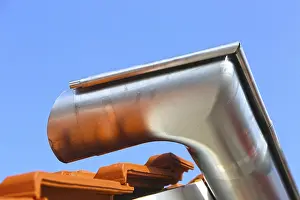 Roofer At Work Images Prints: Newly installed gutter