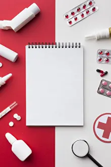 Deserted Healthcare Space Prints: Empty notepad surrounded by pills