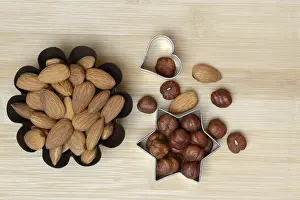 Kitchen Utensils For Baking Prints: Nuts and cookie cutters, almonds and hazelnuts