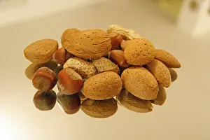 Studio Shot Of Nuts Prints: Nuts on a mirror