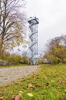 European Autumn Scene Prints: Observation tower next to a path surrounded by autumn trees
