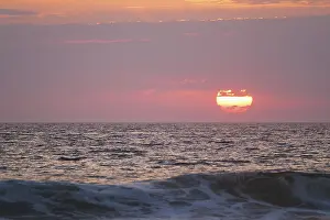 Wave Breaker Photography Prints: Ocean waves on sunset with setting sun background