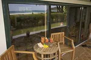 Deserted Beach Scenery Prints: Oceanfront lanai with reflection of view