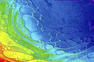 Deserted Waterfront Structures Prints: Oil bubbles inside water base form patterns