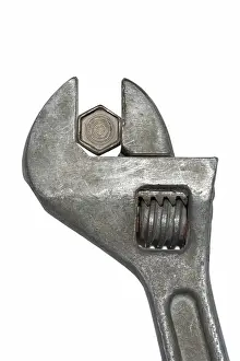 Adjustable Spanner Prints: Old adjustable spanner with bolt isolated on white background