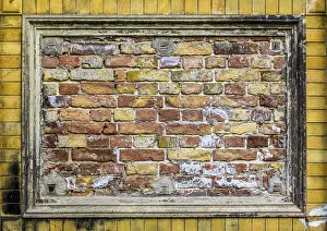 Deserted Brick Wall Prints: Old brick wall pattern closeup with stucco frame