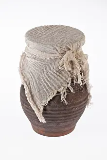 Handmade Ceramic Art Prints: Old ceramic pot on an isolated studio background