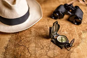Deserted Tropical Landscape Prints: Old expedition map with compass and binoculars