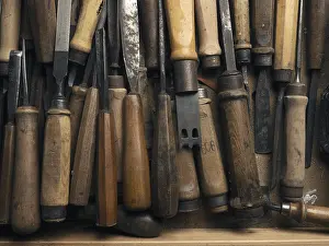 Wood Carving Tools Prints: Old used chisel in a workbench drawer