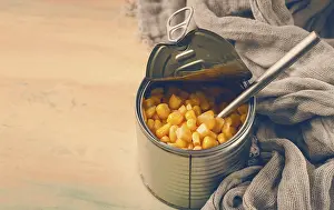 Selective Focus On Corn Prints: Open tin can, with corn, top view
