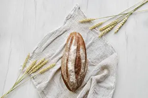 Light Background Images Prints: Overhead view of rue bread on light background