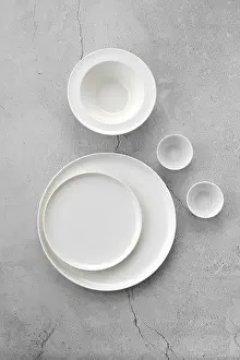 Grey Background Prints: Overhead view of white tableware on grey background