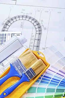 Colorful Design Prints: Paint brushes and rolls of blueprints