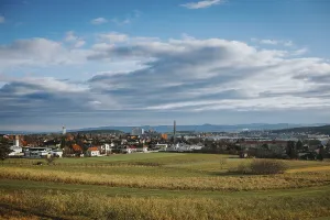 European Panoramic Photography Prints: Panorama with city, fields and mountains under variable sky