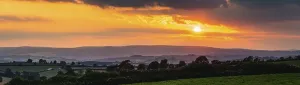 Cloudy Sky With Setting Sun Prints: Panorama of Sunset over Torquay Fields
