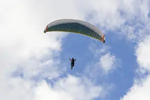 Paragliding In Germany Prints: Paraglider in the sky in front of clouds
