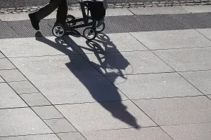 Winter Scene Prints: Passers-by with rollator, shadow