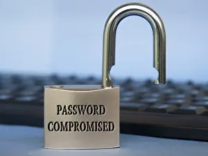 Computer Hacking Crime Prints: Password compromised text engraved on padlock with blurred keyboard background