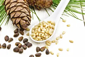Italian Stone Pine Prints: Peeled kernels of cedar nuts in a spoon