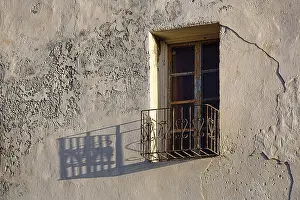 Deserted Building Exterior View Prints: Peeling facade, window with balcony