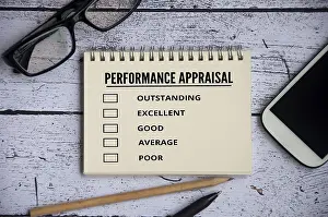 Performance Appraisal Checklist Prints: Performance appraisal checklist on notepad with with office setting background
