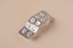 Close Up Medical Care Prints: Empty pill packaging on beige background