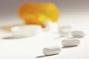 Dramatic Lighting Prints: Pills and fallen bottle with dramatic lighting