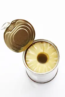 Studio Shot Of Pineapple Prints: Pineapple slices in an opened tin