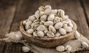 Salty Snack Options Prints: Some whole Pistachios (selective focus)