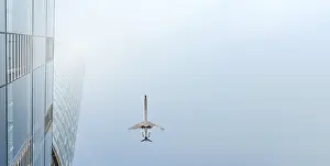 Modern Architecture Photography Prints: A plane flies over a skyscraper