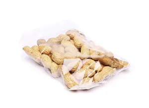 Studio Shot Of Peanuts Prints: Plastic bag of peanuts on the white background