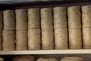 Brown Linen String Prints: Plenty of spools or rolls of brown color linen string